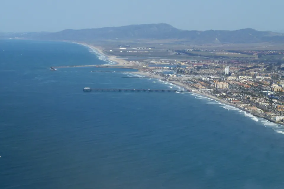An aerial photo of the Oceanside Pier in Oceanside. The Oceanside Marina is also visible.